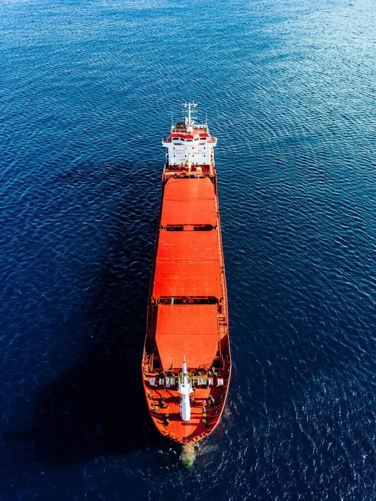 aerial view of general cargo ship in blue sea view from above 1
